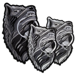 May include: Two embroidered iron-on patches featuring a detailed black and white wolf head with a skull and bones design.