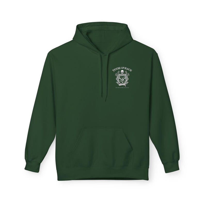 May include: A dark green hoodie with a front pocket and a hood. The hoodie features a white graphic on the upper left chest that includes a skull, text that reads "HOUSE OF BLACK", and other decorative elements. The hoodie is made of a soft material.