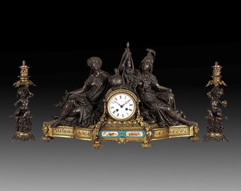 Mantle Clock with Two Cherub Oil Lamps • An Exceptional Very Fine French Mid-19th Century Triptych Gilt Bronze Sculptured Figural Empire