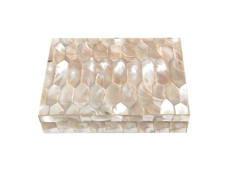 May include: Rectangular decorative box with a mother-of-pearl mosaic design. The box features a hinged lid and is composed of iridescent, hexagonal tiles in shades of cream and beige. The box is a decorative storage item.