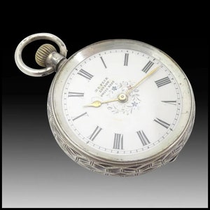 A Silver Open-faced Swiss Pocket Watch • With Enamel Dial Marked H. E. Peck London Circa. 1890.