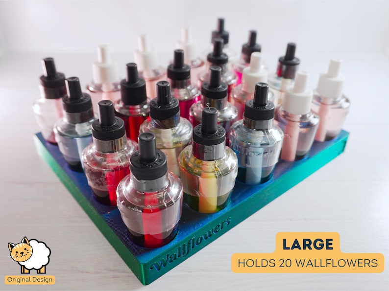 May include: A teal blue plastic holder with 20 clear glass bottles with black caps. The holder is labeled "Wallflowers" and says "Large Holds 20 Wallflowers".