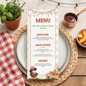 May include: A vertical rectangular menu card for Brittany's Baby Shower on 10.05.26, featuring a string of lights at the top, a light beige gingham background, and red text. The menu lists appetizers, main courses, and desserts with barbecue illustrations.