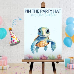 May include: A Pin the Party Hat on the Turtle game poster featuring a central illustration of a sea turtle swimming above coral reefs. The text reads PIN THE PARTY HAT on the turtle. A separate party hat with colorful polka dots is shown to the left.