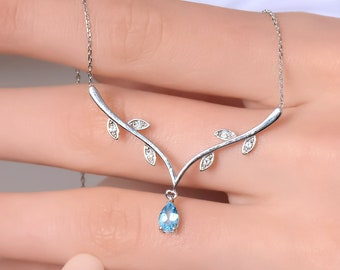Swiss Blue Topaz Solid Gold Necklace: Diamond Accent Leaf Pendant