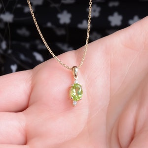 14K Gold Oval Peridot Necklace: Diamond Accent Birthstone Pendant