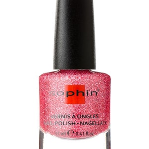 K&ouml;nnte beinhalten: Eine durchsichtige Glasflasche mit schwarzem Deckel von Sophiin Nagellack. Der Lack ist in einem glitzernden Rosaton. Das Etikett auf der Flasche lautet "Vernis &agrave; Ongles Nail Polish Nagellack 12 ml e 0.41 fl.oz."