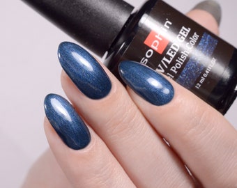 Shimmering blue gel polish. Sophin 0735 Cosmic blue. Spectacular glossy shine, bright color, stunning durability.