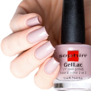 May include: A bottle of light pink nail polish with a black cap and the text "sophin® GelLac UV nail polish base & color 2 in 1 12 ml e 0.41 fl.oz."