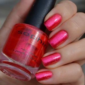 Shimmering coral red nail polish. Sophin 0175 . Bright sparkling manicure finish. For trendy look nails. Must have for parties.