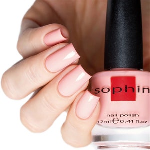 Soft peach-pink nail polish. Sophin 0014. warm color lacquer. cosmetics for natural nails. pastel glossy finish. stylish manicure.