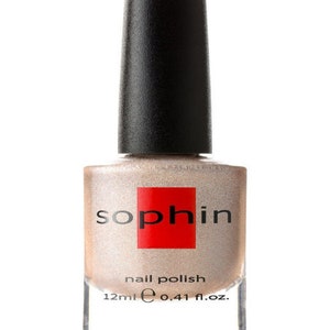 May include: A bottle of Sophi nail polish in a shimmery champagne color. The bottle is 12 ml or 0.41 fl. oz.