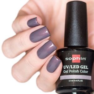 May include: A bottle of Sophiin UV/LED Gel Gel Polish Color in a deep purple shade with a shimmer finish. The bottle is 12 ml (0.41 fl oz).