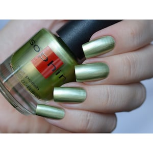 Green metallic nail polish. Sophin 0321. Light herbal color lacquer with silver shimmer. For beautiful natural manicure. glitter nails.