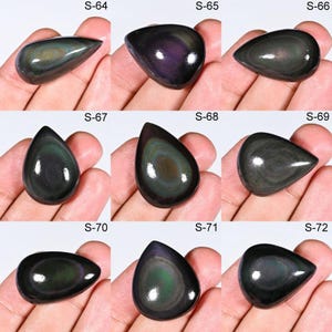 May include: Nine polished obsidian gemstones in various shapes, each displaying a dark, iridescent sheen with swirls of color. The gemstones are labeled S-64 through S-72.