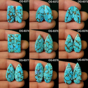 May include: Nine pairs of turquoise cabochons, each pair is a different shape and size. The cabochons are a mix of blue and green colors with brown matrix. The cabochons are labeled with the numbers OG-8371 through OG-8379.