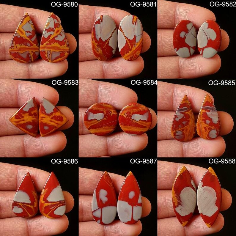 May include: Nine pairs of red, white, and brown agate cabochons in various shapes, including oval, teardrop, and diamond. Each pair is labeled with a unique code, such as OG-9580, OG-9581, and OG-9582.