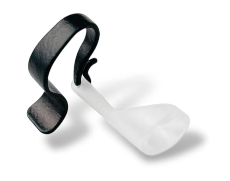 Deafmetal Insurance Clip works to keep hearing aids attached to the ear for hearing aid retention