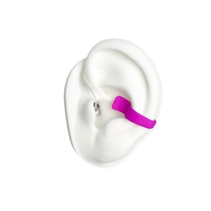 deafmetal insurance flexi clip shown on a white silicone ear and the color of the clip is pink or fuschia