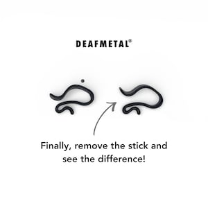 May include: Image features two black, abstract shapes with a dot above one. An arrow points from the first shape to the second. The text "DEAFMETAL&reg;" is at the top, and below, "Finally, remove the stick and see the difference!"