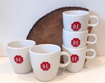 Douwe Egberts, set of two white or three large mugs, or two, three, or four small mugs, featuring the red Douwe Egberts brand mark (seal)