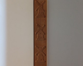 Dutch biscuit board, probably made of (beech) wood, three biscuit molds from Dutch mills, the seesaw, polder and scaffolding mill, 1980s