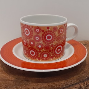 Mosa - Maastricht, Holland, a beautiful flower power cup and saucer, decorated with orange-red flowers, orange-coloured background, 1960s
