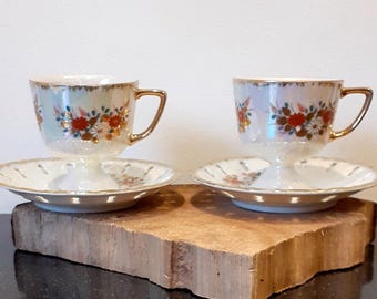 Versailles porcelain, two beautiful cups and saucers, mother-of-pearl glaze, lusterware, openwork saucer, 'retro' floral motif, 1950s