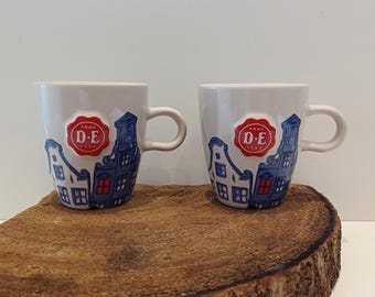 Douwe Egberts, tasse simple ou ensemble de deux ou trois tasses, images de maisons de canal, relief de la marque Douwe Egberts (sceau)