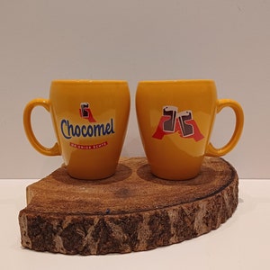 Chocomel, one mug or set of two special &#39;friendship&#39; mugs, with an image of two hands clinking glasses of chocolate milk