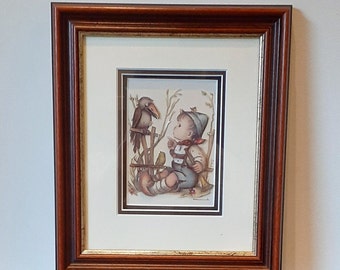 3-D wall decoration by Hummel, depicting a boy looking surprised at a black bird, wood with gold frame, behind glass, 1980s