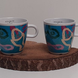 Douwe Egberts, set of two colored large coffee or cappuccino mugs, with the Douwe Egberts mark on the inside image 1