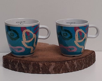 Douwe Egberts, set of two colored large coffee or cappuccino mugs, with the Douwe Egberts mark on the inside