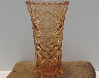 An amber-pink colored heavy vase, 418 grams, made of glass, scalloped rim, beautifully crafted, unmarked