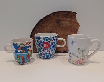 Various mugs, Douwe Egberts - cappuccino mug, Douwe Egberts - M.Rebel, mug image cow, J. Brinkman, coffee mug, wild flowers