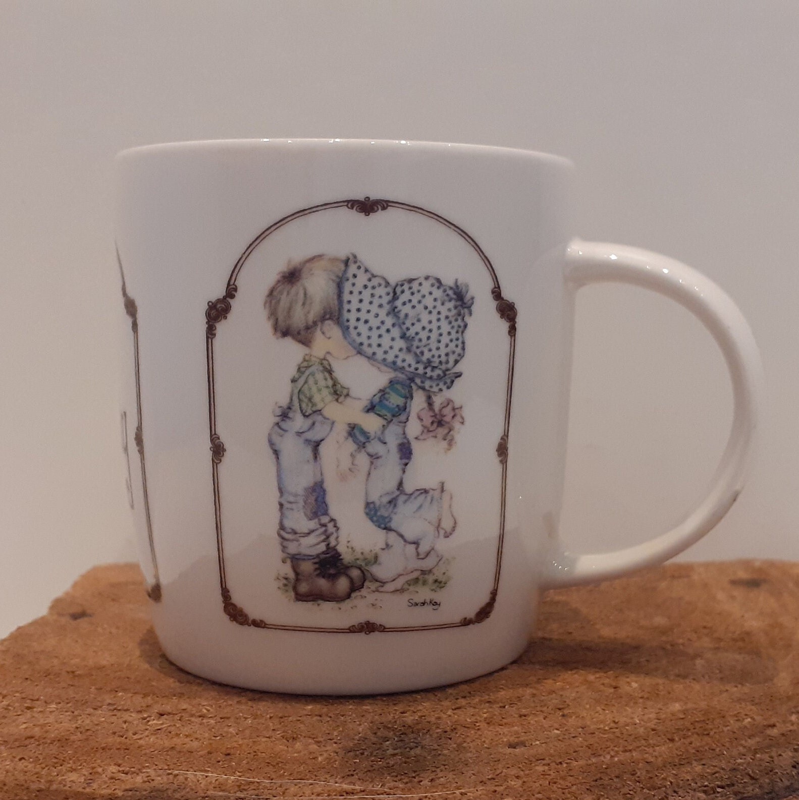 Sarah Kay, a large mug (350 ml!), with two nostalgic images and the name 'Sarah Kay' on the handle and the mug, 1980s