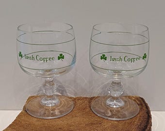 Set of two glasses intended for Irish Coffee, on a beautiful diamond base, grass green print with shamrock's and graduation, 70's