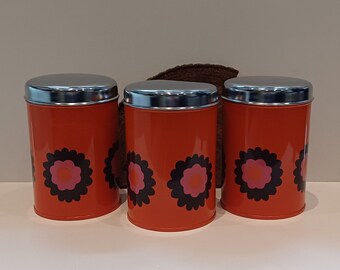 Brabantia, set van drie vintage, retro flowerpower oranje bewaarblikken, decor 'Patrice', bruine en fuchsia bloemen, 70's, made in Holland,