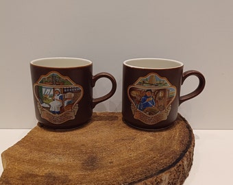 Villeroy & Boch, Douwe Egberts, set of three dark brown coffee mugs, with beautiful images and accompanying rhyming caption, 70's