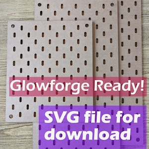 May include: Three brown pegboards of different sizes with holes for hanging items. The pegboards are on a wooden surface. The text "Glowforge Ready! SVG file for download" is on the image.