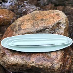Handmade porcelain pottery olive tray, appetizer platter, and serving platter. Haand porcelain pottery handmade in Burlington, NC