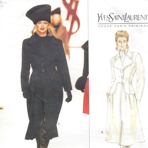 May include: Vogue Patterns sewing pattern featuring two Yves Saint Laurent designs. One is a black coat with a matching hat and gloves. The other is a white coat with a contrasting trim. The pattern includes sizes 6-8-10.