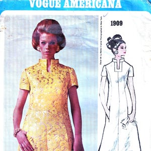 May include: A vintage Vogue Americana sewing pattern. The image shows a yellow floral dress by Oscar de la Renta, with a photograph and a line drawing. The pattern number 1909 is displayed.