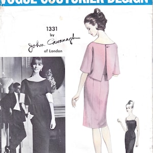 May include: A vintage Vogue Couturier Design sewing pattern envelope, number 1331 by John Cavanagh of London. The cover features illustrations of a pink dress with a short-sleeved jacket and a black dress, alongside a black and white photograph.
