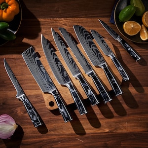 May include: A set of eight kitchen knives with black and silver handles. The knives are arranged on a wooden cutting board with a marble pattern.