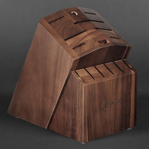 May include: A dark brown wooden knife block with a slanted design. The block has multiple slots for knives and a logo that reads "Fenwick Fine."