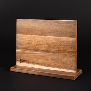 May include: A wooden magnetic knife holder with a stand. The holder has a natural wood finish and the brand name "SENKEN" is engraved on the front.