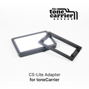 May include: A black CS-Lite Adapter for the toneCarrier. The adapter is a rectangular frame with a white light inside. The adapter is designed to fit the toneCarrier.