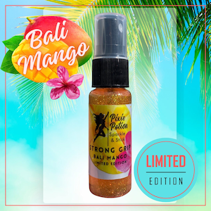 May include: A small bottle of gold glitter spray with a black cap and label. The label says "Pixie Potion Sparkle & Stick Strong Grip Bali Mango Limited Edition". The bottle is in front of a tropical background with a mango and a flower.