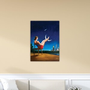 May include: A painting depicts a woman seated in a chair, gazing at a night sky with stars and crescent moons. She wears a red skirt and a blue top. A city skyline is visible in the distance, with a lake in the foreground.